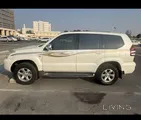 تويوتا برادو ڤي إكس 2009 - سيارة مستعملة بيضاء بناقل حركة أوتوماتيكي