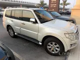 ميتسوبيشي باجيرو 2015 3.5 لتر - أبيض، 7 مقاعد، سجل خدمة كامل، السعر 33 ألف ريال قطري