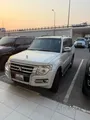 ميتسوبيشي باجيرو 2015 3.5 لتر - أبيض، 7 مقاعد، سجل خدمة كامل، السعر 33 ألف ريال قطري