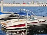 Bayliner 5.3 m boat with trailer, paid parking, and major recent service