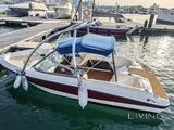 Bayliner 5.3 m boat with trailer, paid parking, and major recent service