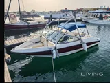 Bayliner 5.3 m boat with trailer, paid parking, and major recent service