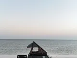 Roof tent and awning and shower tent and spare tire storage with windshield 
