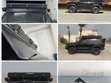 Roof tent and awning and shower tent and spare tire storage with windshield 
