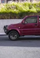 Open-air Adventure Red Suzuki Jimny